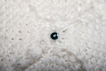 Hand knitted brooch in white