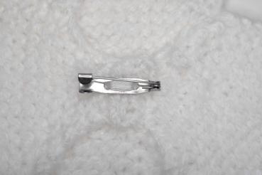 Hand knitted brooch in white