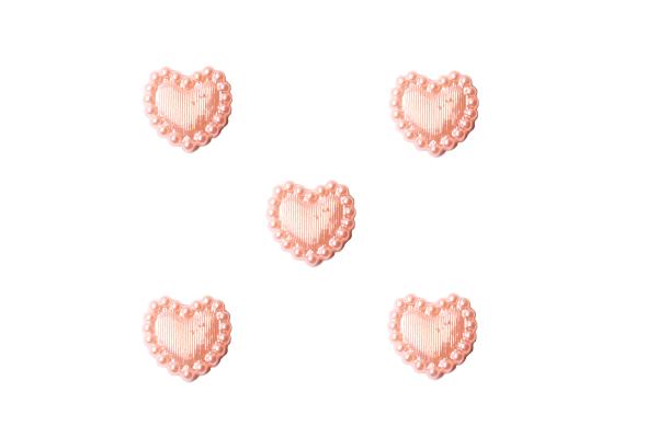 Facets as hearts in pink as plastic